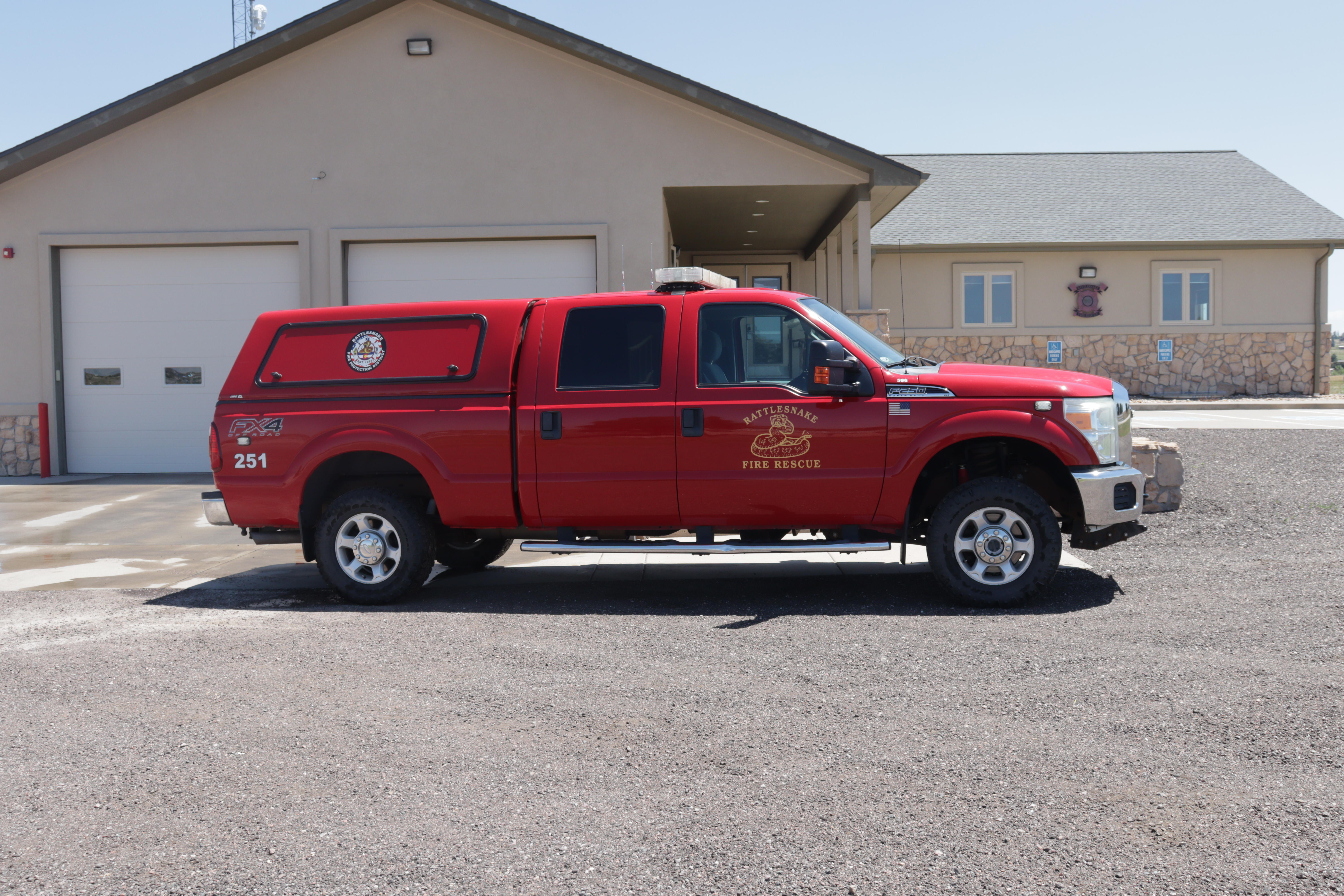 Command 251 parked in front of the Administration Building / Training Center