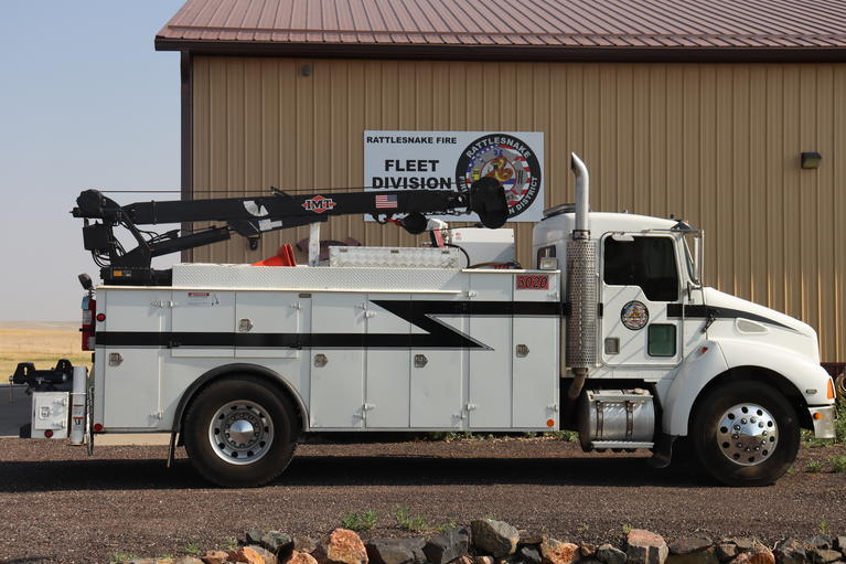 Fleet Service truck parked next to the Fleet Services building